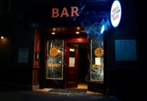 Broken glass at Super Abari Game Bar after a theft incident