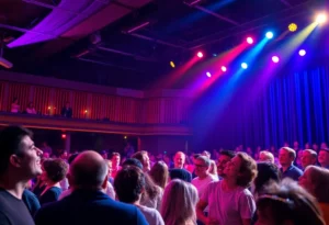 Audience enjoying a live comedy performance at a vibrant stage.