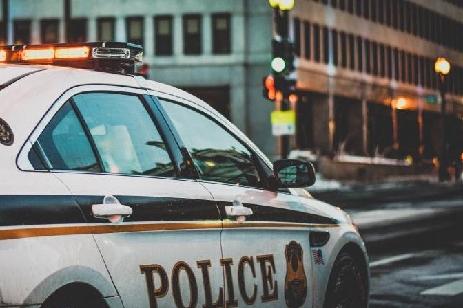 Police car parked along a city street