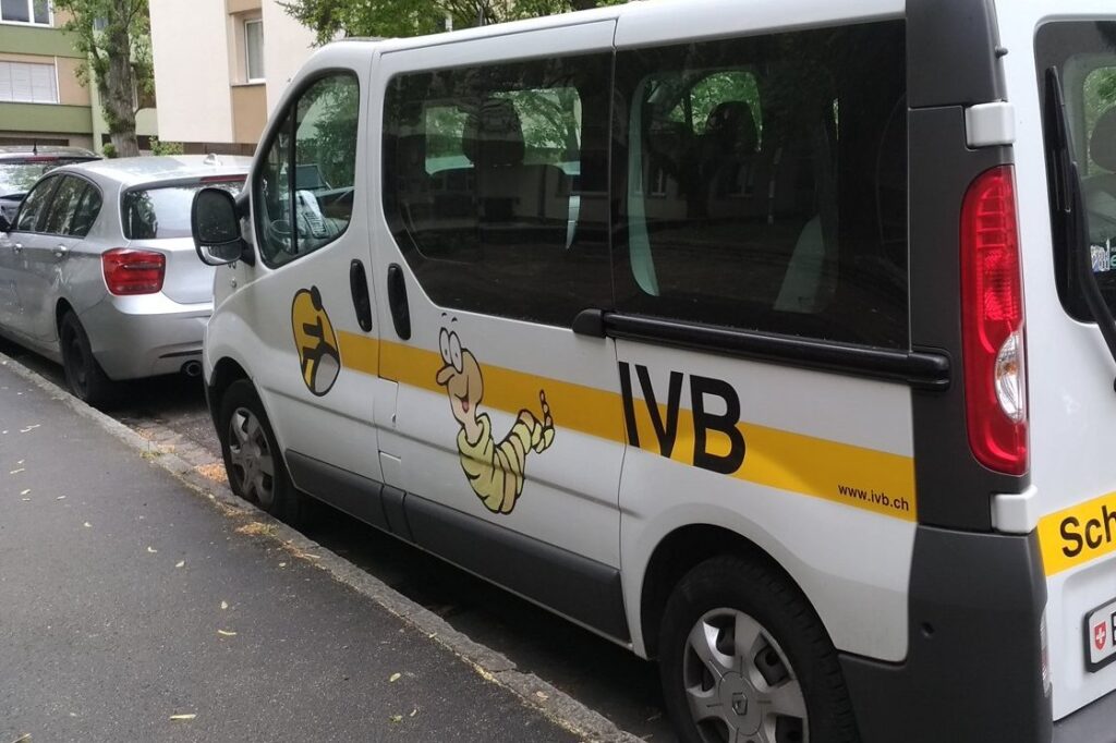 Small school bus parked on a street